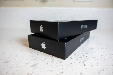 Seattle, WA USA - circa May 2022: View of two iPhone 13 Pro boxes on a kitchen counter inside a home