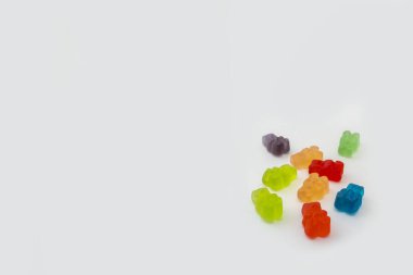 Colorful set of CBD infused medicinal candy gummies used for healing on a plain white background