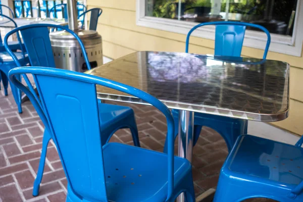 Colorful View Bright Blue Chairs Gathered Reflective Metal Table Outdoor — Stock Photo, Image