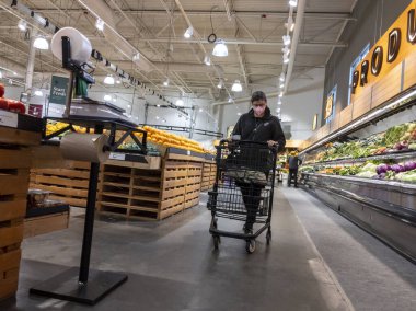 Mill Creek, WA USA - circa June 2022: Wide angle view of people shoppping in the produce section of a Town and Country Market