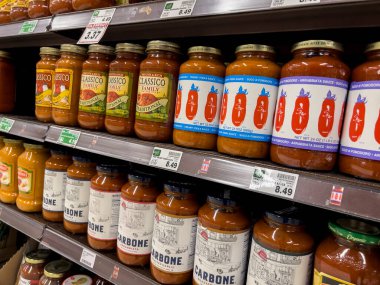 Everett, WA USA - circa June 2022: Angled close up view of pasta sauces for sale inside a Fred Meyer grocery store.