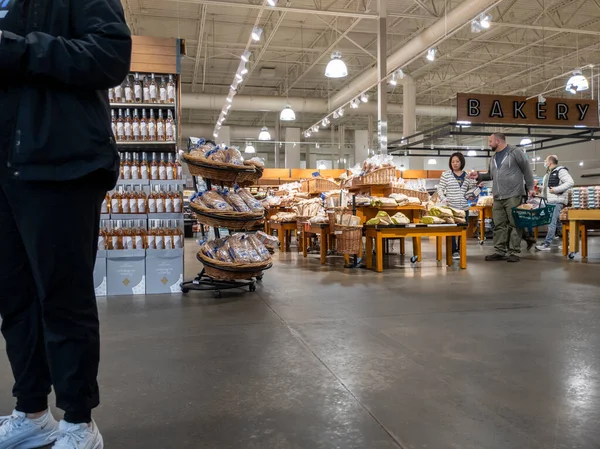 Mill Creek, WA USA - circa June 2022: View of people shopping for bread and pastries inside a Town and Country grocery store.
