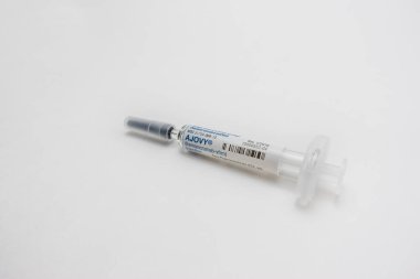 Seattle, WA USA - circa July 2022: Close up, selective focus on Ajovy medication against a white background.