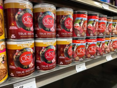 Mill Creek, WA USA - circa June 2022: Angled, selective focus on canned dog food for sale inside a Town and Country grocery store