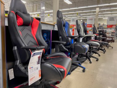 Mill Creek, WA USA - circa June 2022: Close up of Emerge gaming chairs for sale inside a Staples store.
