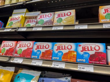 Mill Creek, WA USA - circa June 2022: Angled, selective focus on instant Jell-o mixes for sale inside a Town and Country grocery store.