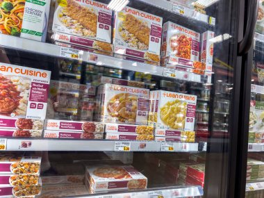 Everett, WA USA - circa June 2022: Angled selective focus on Lean Cuisine frozen meals for sale inside a Fred Meyer grocery store.