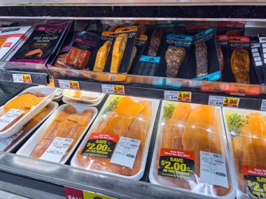 Everett, WA USA - circa June 2022: Close up focus on salmon fillet for sale inside a Fred Meyer grocery store.