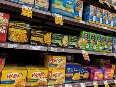 Everett, WA USA - circa June 2022: Angled, selective focus on boxed macaroni and cheese for sale inside a Fred Meyer grocery store.