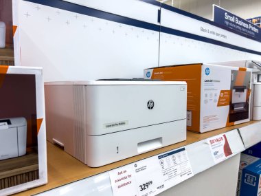 Seattle, WA USA - circa June 2022: Angled, selective focus on HP printers for sale inside a Staples store