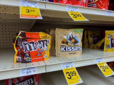 Everett, WA USA - circa August 2022: Angled, selective focus on bagged candy for sale inside an Albertsons grocery store.