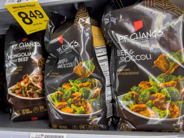 Everett, WA USA - circa August 2022: Angled, selective focus on P. F. Changs freezer meals for sale inside an Albertsons grocery store