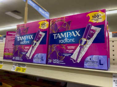 Everett, WA USA - circa August 2022: Angled, selective focus on tampon products for sale inside an Albertsons grocery store