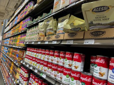 Mill Creek, WA USA - circa May 2022: Angled view of a collection of canned soups for sale inside a Town and Country Market.