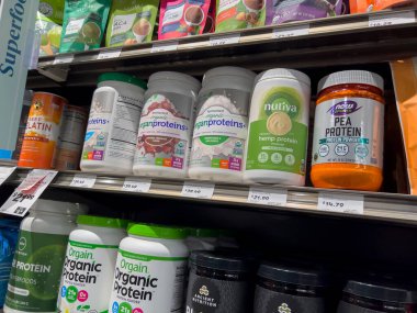 Mill Creek, WA USA - circa May 2022: Angled, selective focus on a variety of protein powders and supplements inside a Town and Country Market
