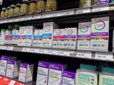 Mill Creek, WA USA - circa May 2022: Angled, selective focus on prenatal supplements for sale inside a Town and Country Market.