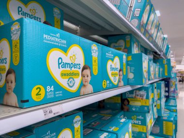 Seattle, WA USA - circa August 2022: Angled, selective focus on baby diapers and training pants for sale inside a Target retail store.