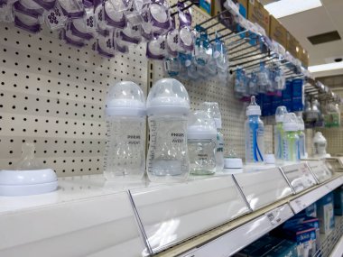 Seattle, WA USA - circa August 2022: Angled, selective focus on baby bottles for sale inside a Target retail store.