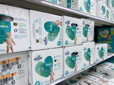 Seattle, WA USA - circa August 2022: Angled, selective focus on baby diapers and training pants for sale inside a Target retail store.