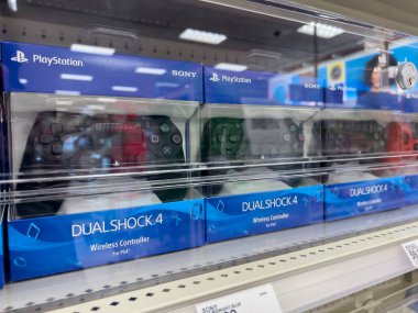 Seattle, WA USA - circa August 2022: Angled, selective focus on Playstation controllers for sale inside a Target store