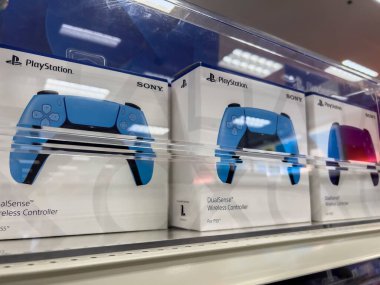 Seattle, WA USA - circa August 2022: Angled, selective focus on Playstation controllers for sale inside a Target store