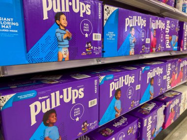 Seattle, WA USA - circa August 2022: Angled, selective focus on baby diapers and training pants for sale inside a Target retail store.