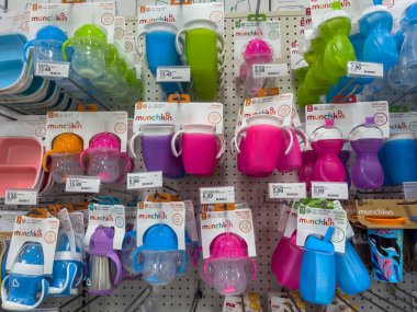 Lynnwood, WA USA - circa August 2022: Selective focus on Munchkin brand baby eating and drinking utensils for sale inside a Target retail store.