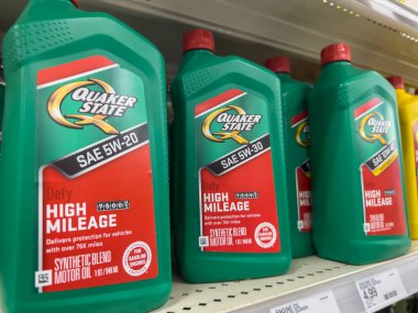Seattle, WA USA - circa August 2022: Close up, selective focus on Quaker State car motor oil for sale inside a Target retail store