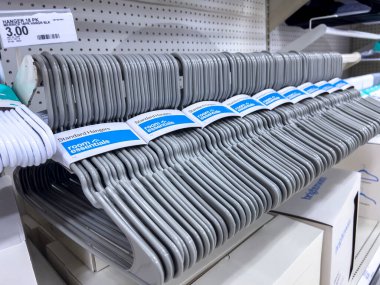 Seattle, WA USA - circa August 2022: Close up, selective focus on clothes hangers for sale inside a Target retail store.