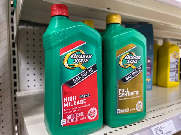 Seattle, WA USA - circa August 2022: Close up, selective focus on Quaker State car motor oil for sale inside a Target retail store