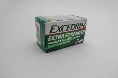 Seattle, WA USA - circa July 2022: Close up, selective focus on Excedrin migraine relief medication on a white background