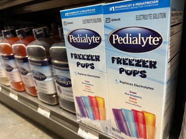Mill Creek, WA USA - circa June 2022: Close up, selective focus on Pedialyte hydration products for sale inside a Town and Country Market.