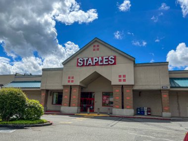 Mill Creek, WA USA - circa June 2022: Street view of the exterior to a Staples Office Supply store in the downtown area.