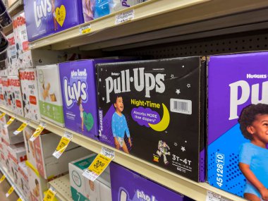 Seattle, WA USA - circa August 2022: Close up, selective focus on baby diapers for sale inside a Safeway grocery store.