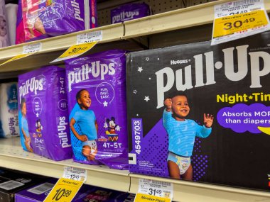 Seattle, WA USA - circa August 2022: Close up, selective focus on baby diapers for sale inside a Safeway grocery store.