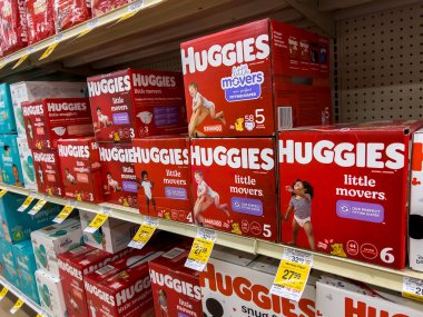Seattle, WA USA - circa August 2022: Close up, selective focus on baby diapers for sale inside a Safeway grocery store.
