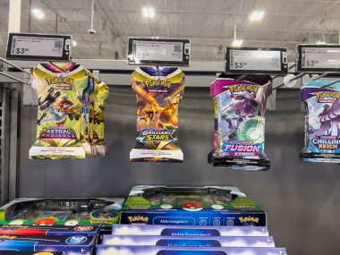 Lynnwood, WA USA - circa August 2022: Close up, selective focus on Pokemon cards for sale inside a Best Buy store.