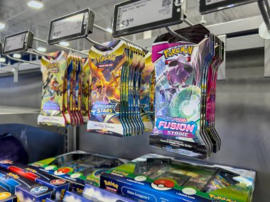 Lynnwood, WA USA - circa August 2022: Close up, selective focus on Pokemon cards for sale inside a Best Buy store.