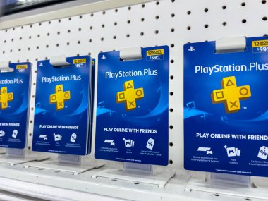Lynnwood, WA USA - circa August 2022: Close up, selective focus on Playstation Plus subscription cards for sale inside a Target retail store.