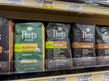 Seattle, WA USA - circa August 2022: Close up, selective focus on bagged coffee for sale inside a Safeway grocery store.