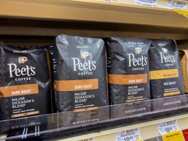 Seattle, WA USA - circa August 2022: Close up, selective focus on bagged coffee for sale inside a Safeway grocery store.