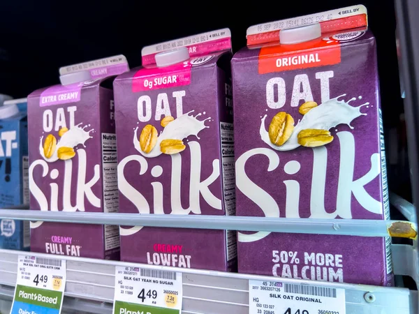 Seattle, WA USA - circa August 2022: Close up, selective focus on milk alternatives for sale inside a Safeway grocery store.