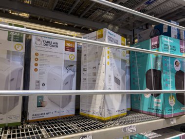 Seattle, WA USA - circa July 2022: Selective, angled focus on air conditioners for sale inside a Lowes Home Improvement store.