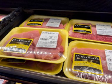 Bellevue, WA USA - circa July 2022: Close up, selective focus on pork for sale inside an Uwajimaya grocery store.