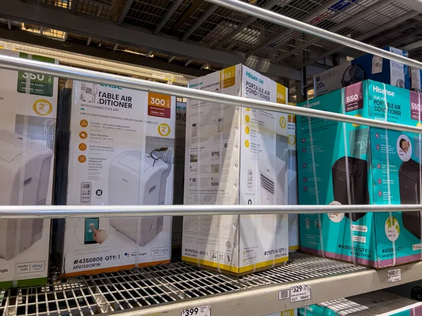 Seattle, WA USA - circa July 2022: Selective, angled focus on air conditioners for sale inside a Lowes Home Improvement store.