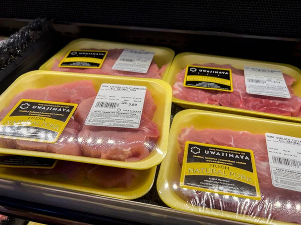 Bellevue, WA USA - circa July 2022: Close up, selective focus on pork for sale inside an Uwajimaya grocery store.
