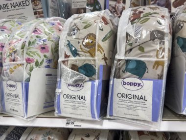 Seattle, WA USA - circa August 2022: Close up focus on Boppy pregnancy pillows for sale inside a Target retail store.
