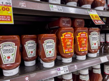 Seattle, WA USA - circa August 2022: Close up focus on Heinz ketchup for sale inside a QFC retail store