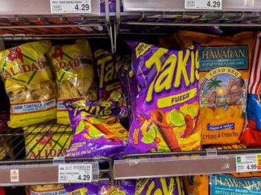 Seattle, WA USA - circa August 2022: Close up view of Takis tortilla chips for sale inside a QFC grocery store.