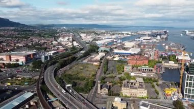 Aerial video of traffic driving through Belfast City Cityscape Northern Ireland 